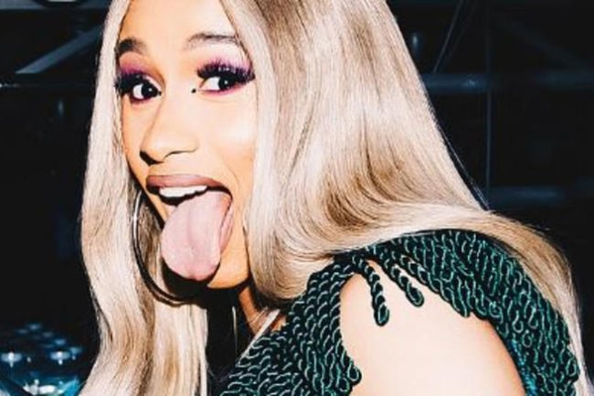 Cardi B goois mic at audience member who threw a drink at her on stage