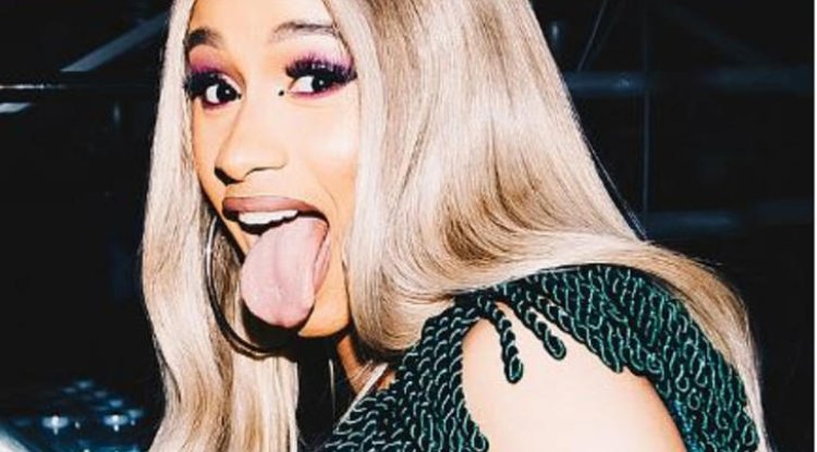 Cardi B goois mic at audience member who threw a drink at her on stage